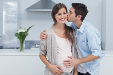 Man kissing his pregnant wife