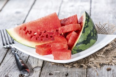 Watermelon slices on white plate to show watermelon fast before and after a watermelon diet for 3 days