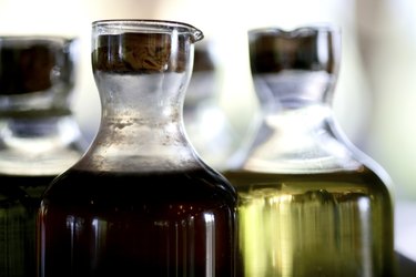 Vinegar and olive oil in a glass bottle
