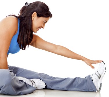 Fit woman stretching