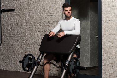 Male Athlete Doing Heavy Weight Exercise For Biceps