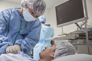 Surgeon consulting a patient, getting ready for surgery