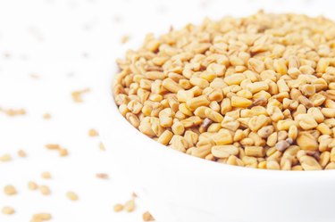 Fenugreek seeds in white bowl