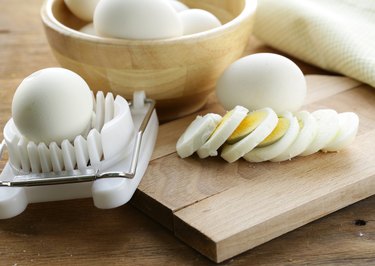 sliced boiled egg for salad on the board