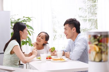 Family eating in kitchen