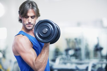 Man holding dumbbell