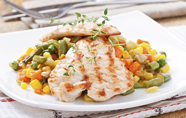 Grilled chicken breasts and vegetables