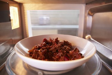 Leftover Chili Cooking Inside Microwave Oven
