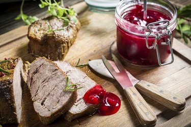 Closeup of venison with cranberry sauce