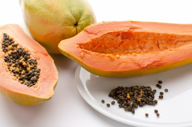 Hollowed Out Papaya Half And Its Peppery Seeds