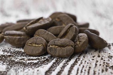 Coffee beans on wood background