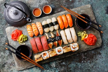 Sushi Set nigiri and sushi rolls with tea