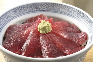 Rice bowl with slices of raw tuna