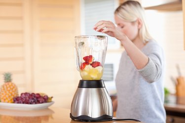 Side view of blender getting filled