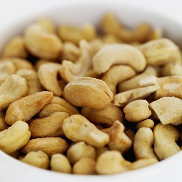 Close-up of bowl of salted cashew nuts