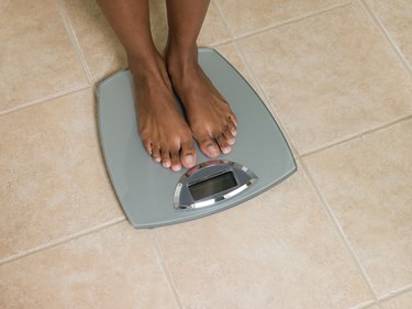 Feet of woman on scales