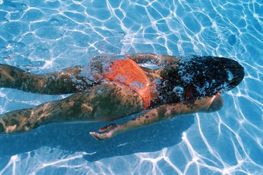Woman swimming underwater