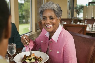 Woman eating vegetable dish