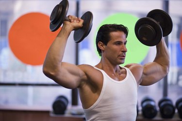 Man lifting weights at gym