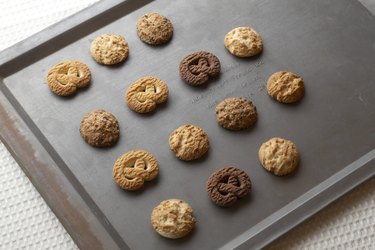 Cookies on baking tray, high angle view