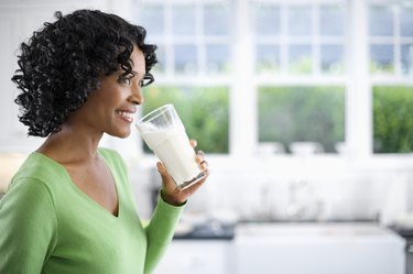 Woman Drinking Glass of Milk