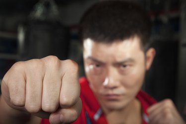 Close up of boxer throwing a punch at the camera