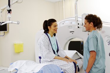Technician giving patient instructions for ultrasound