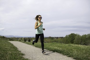 A woman running in a park.