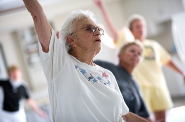 Woman exercising with others