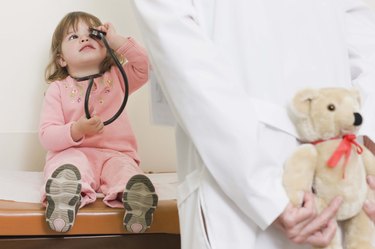 Girl playing with stethoscope