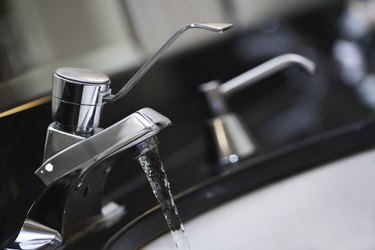 Water flowing from bathroom faucet