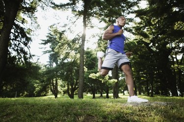 Man jogging through woods