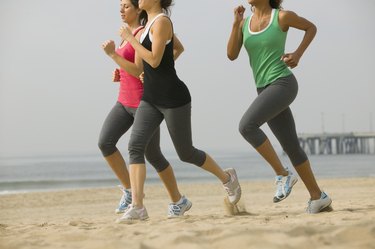Women running on beach
