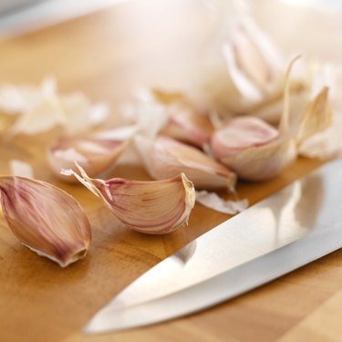 elevated view of garlic and a knife