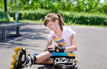 Skater nursing an injured knee