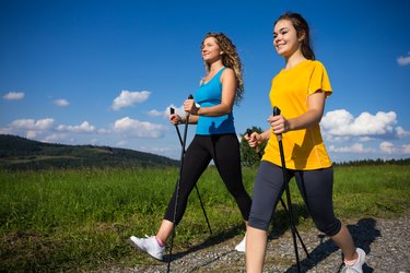 Healthy lifestyle - young women Nordic walking