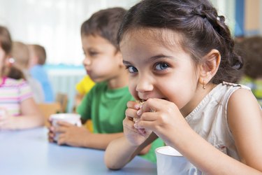 Cute little children drinking milk