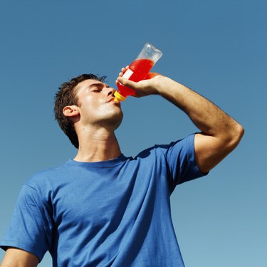 close-up of a young man drinking sport drink