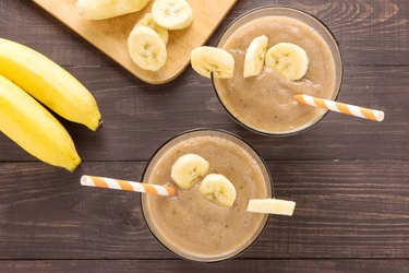 Top shot banana smoothie on wooden background