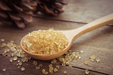 Brown sugar on wooden spoon