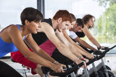 Group of People Cycling at Gym