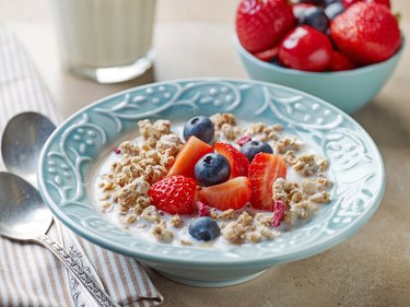 healthy breakfast, bowl of muesli with milk