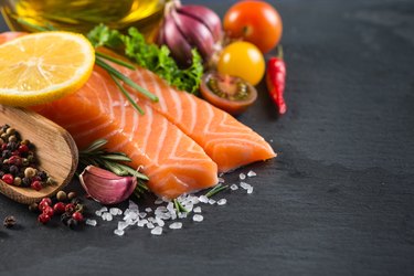 Portion of fresh salmon with spices,herbs and vegetables