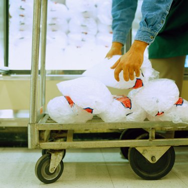 Man Unloading Bags of Ice