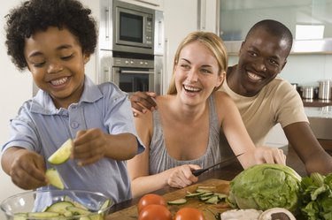 Family cooking in kitchen