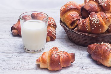 bagels with a glass of milk on a blurred background