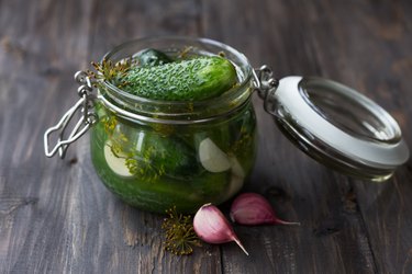 Glass jar of fresh low-salt pickled cucumbers