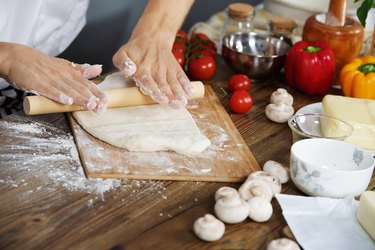 Cook prepare pizza dough