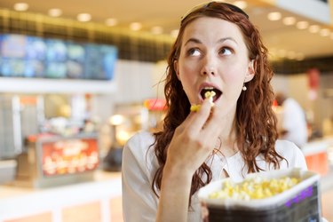 Woman eating popcorn