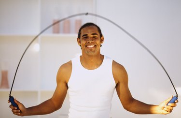 Close-up of a young man using a skipping rope